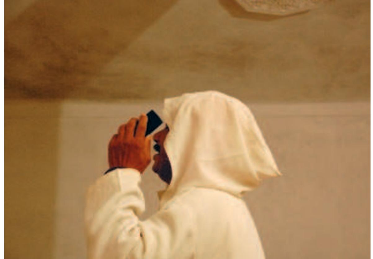 During a ritual, a hellal recites verses for an ‘Isawi living abroad Photo: Anja Dreschke, 2008  If at all possible, relatives in Europe are informed about ritual gatherings in advance and may try to join, if only by a telephone call. This way, adepts from all places continue “to meet” by means of the mobile phone at the rituals. 