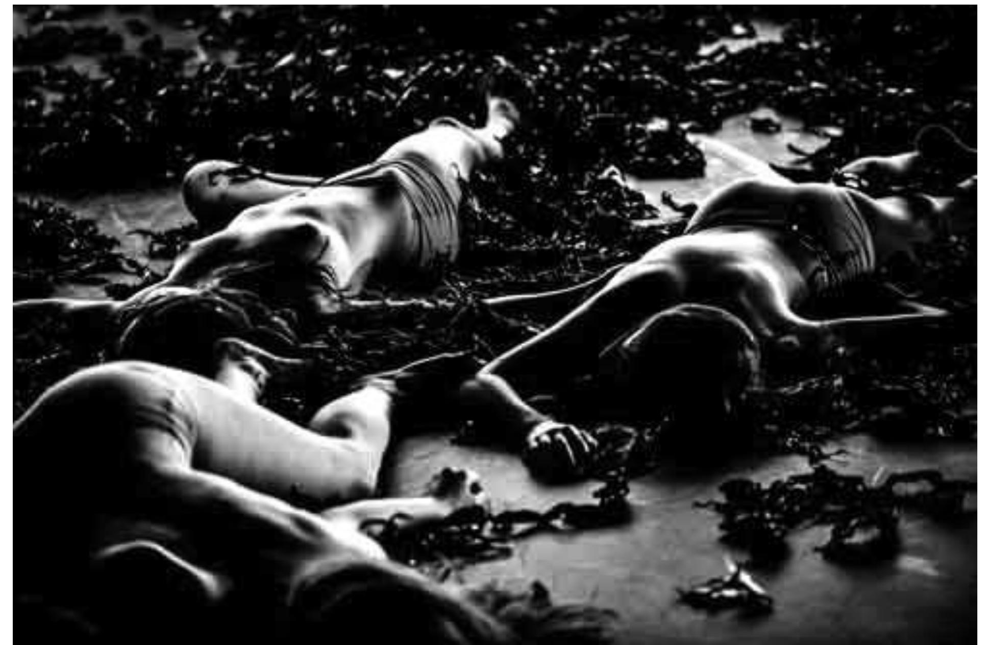 Der Tod in Venedig / Kindertotenlieder, directed by Thomas Ostermeier. Photo: Courtesy of Schaubiihne am Lehniner Platz Berlin.  When Aschenbach starts worrying about  At the play's climax, Tadzio's sisters enter in their nun-like dresses at the back of the stage and take off their shoes. As they move downstage, they begin dancing, both fiercely and sensuously, with Dionysian passion. They shed their nun-like gowns and dance naked with one another, fighting with each other and mercilessly pulling at each other's bodies like crazed Maenads. While all this is happening, dark objects drop from the flies and float 