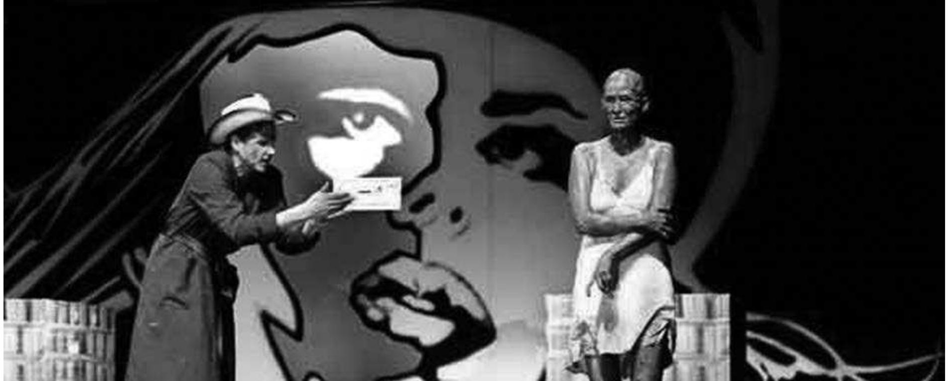 Brecht’s Saint J oan of the Stockyards, directed by Sebastian Baumgarten. Photo: Tania Dorendorf.  For most of the evening the eleven performers, ranging in age from eighteen to fifty, stand orsitin arow of chairs upstage, while anarrator/ translator sits at a downstage table to the right, introducing the audience to the performance. First the narrator outlines the history of the project and asks the actors to introduce themselves. Their brief autobiographical statements always include their profession: actor. In the major part of the evening, each performer presents a dance piece he or she has created themselves, to a musical accompaniment they have chosen. From a conventional technical point of view some of these are moderately skilled, while others are most commendable for their determination and dedication. All, however, receive hearty applause from the audience, although not unmixed with a certain unease at the entire process. This unease is articulated more fully in a concluding section of the performance where the narrator asks each performer to talk about their experience in creating and performing this piece. Most speak   This railway car is in fact essentially a kind of film set, however, with scenes played in various parts of it and recorded by live video cameras for projection above. The audience thus simultaneously sees the filmed action and its creation within the 