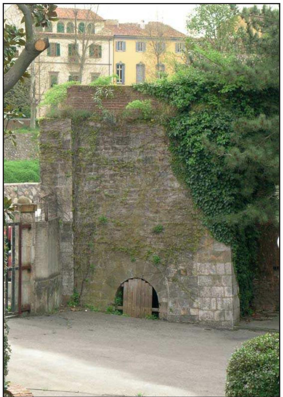 Fig. 3.39 The bell tower of the church of Sant’Andrea in Chinzica as seen today at the entrance of Giardino Scotto.  the burial area, according to the Christian view of death as rebirth, coincided with the orchard, and graves alternated with trees which symbolically represented regeneration. In the western portion, the graves not only are not in a vegetable garden area but the type of hasty burial (in one case a body was thrown in the pit where it remained face down) suggests emergency burials made during an epidemic event of the second half of the XIV century (fig. 3.41). In the church of San Lorenzo in Chinzica, the excavation!” revealed a transformation at the end of XIV century, when a  traumatic event hit the structure of the building  represented regeneration. In the western portion, 