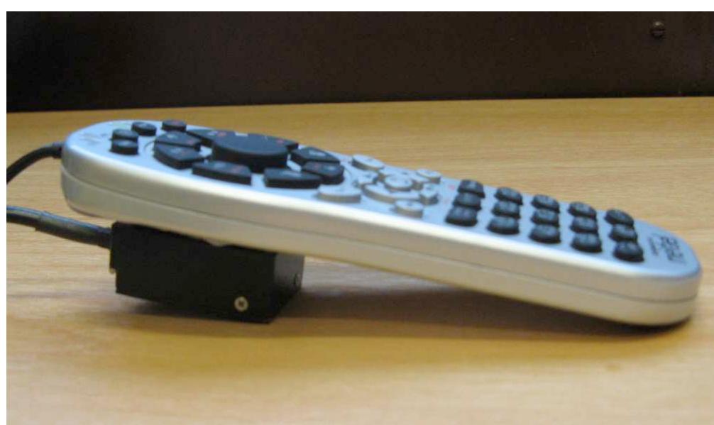 Figure 1. The mobile phone mockup device equipped with an Intersense Inertia Cube3 for motion tracking 
