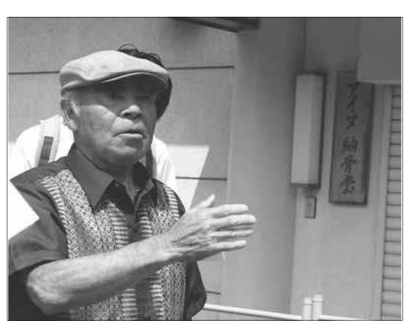 Fig. 4. The Ainu Charnel House is one of the focal points of recent indigenous ecotourism initiatives on Hokkaido University grounds. Here, Ainu-iden- tified guide Ogawa Rytkichi explains the history of Ainu Studies research through the project of gravesite excavations, and describes the memorial ceremonies held each August to ease the suffering of ancestors dismembered and removed from burial grounds.  Politics and Pitfalls of Japan Ethnography 