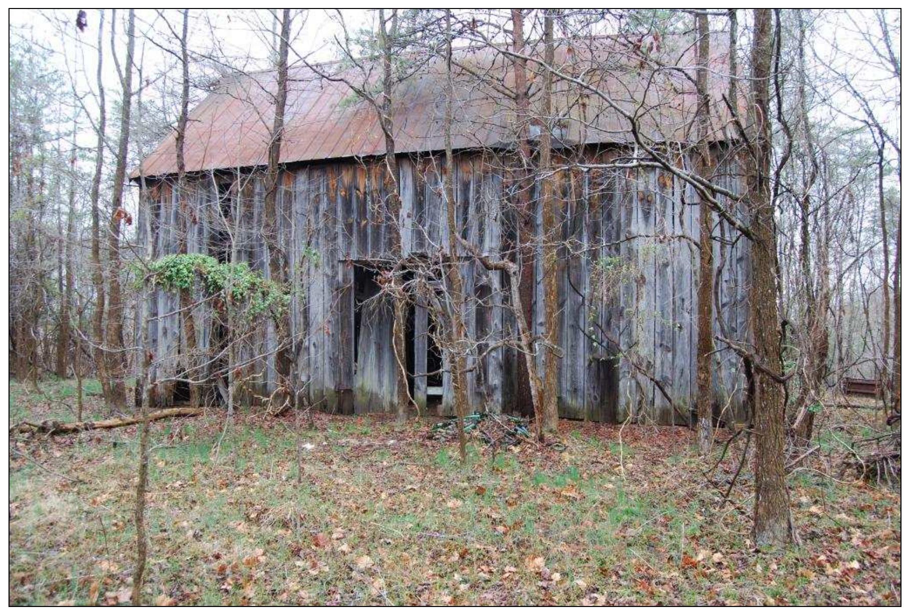 Figure 15. Abandoned tobacco barn located on south knoll, Windy Knolls property. 