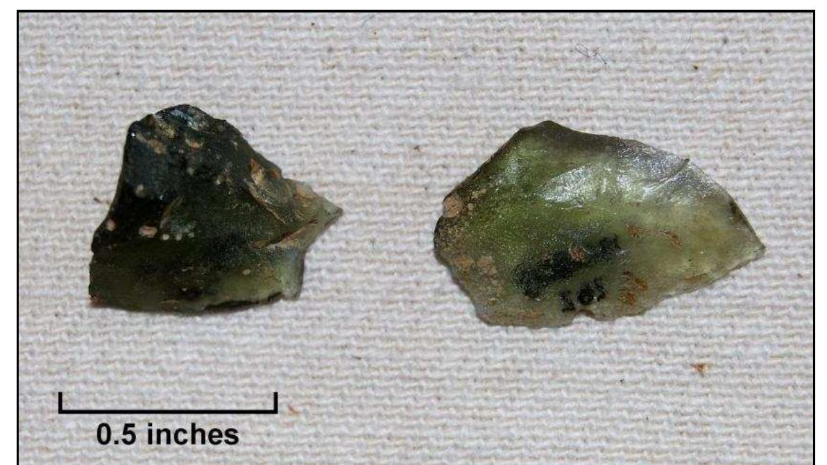 Figure 77. Possible flakes from the working of bottle glass, from test units, Windy Knolls I (left: Lot 262; right: Lot 269). 