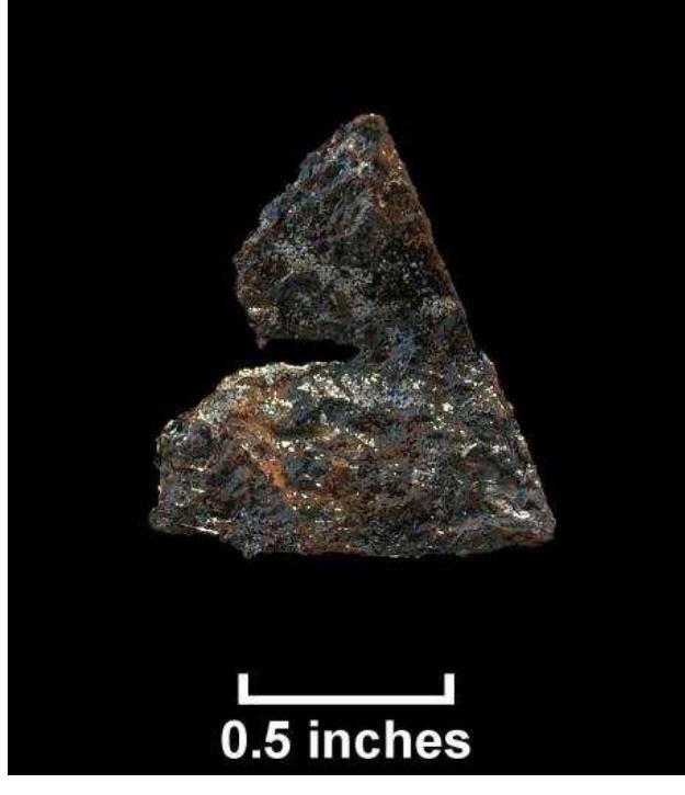 Figure 82. Perforated iron AAIUMACULUYICal CVIUCHICG MlUlCdwo Uldt, il oO LCYLUlio, triangle from test unit, Windy metal points may have begun to replace stone points through the 17" Knolls I (Lot 245). century. Archaeologist Barry Kent provided estimated brass-to-stone point ratios for 17"-century Susquehannock Indian sites in Pennsylvania. Brass points began to appear in very low numbers during the Washington Boro phase (1600-1625) of Susquehannock culture history, with a ratio of about one for every 200 stone points. By the Strickler phase (1645-1665), the brass-to-stone ratio was about 1:1, with isosceles brass points most common. At sites of the Leibhart phase (1665-1680), K ent found, that brass points outnumbered those of stone by about 2:1 with unperforated points predominating, although by Conestoga (1690-1763), perforated points were the norm (Kent 1984:18, 191-192).  contact with the copper. Several of these hafted triangles have been recovered from Susquehannock sites in the lower Susquehanna River valley, a Delaware Indian site in Croton, New York, and a number of other sites in the northeast (Curry n.d.; Veit and Bello 2001:49-50). Perforated points were lashed to the arrow shaft with either plant fibers or animal sinew, while unperforated triangles may have been held in the split shaft with a native-made glue or a cord/sinew wrapping around the shaft just below the base of the triangle, creating a “vice grip of the split shaft on the point” (Kent 1984:190-193). 