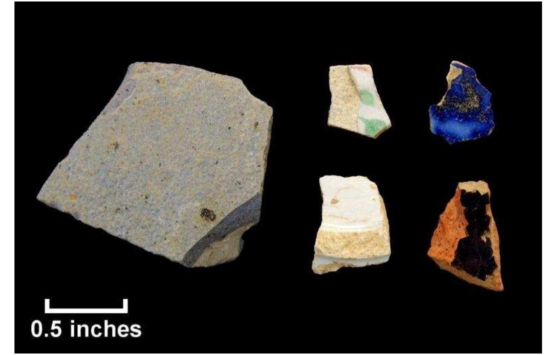 One North American salt-glazed stoneware body fragment was found in association with the majority of the refined earthenwares. American-made “blue and gray” stoneware was ubiquitous through the 19" century (Noél Hume 1969:101). Three unidentified black lead-glazed coarse earthenware sherds and a single sherd of undecorated porcelain were also recovered. Approximately one-third of the brick (n=148.9 grams) and two of the three iron nails were also recovered from this general area. Although not  = ff sy.  Figure 99. Nineteenth-century artifacts recovered from shovel tests, Steffens property; left: North American salt- glazed stoneware (Lot 167); top row, I-r: polychrome painted whiteware (Lot 175); blue painted pearlware (Lot 169); bottom row, |-r: unidentified refined earthenware base (T.ot 171): black lead-alazed earthenware (T.ot. 167). 