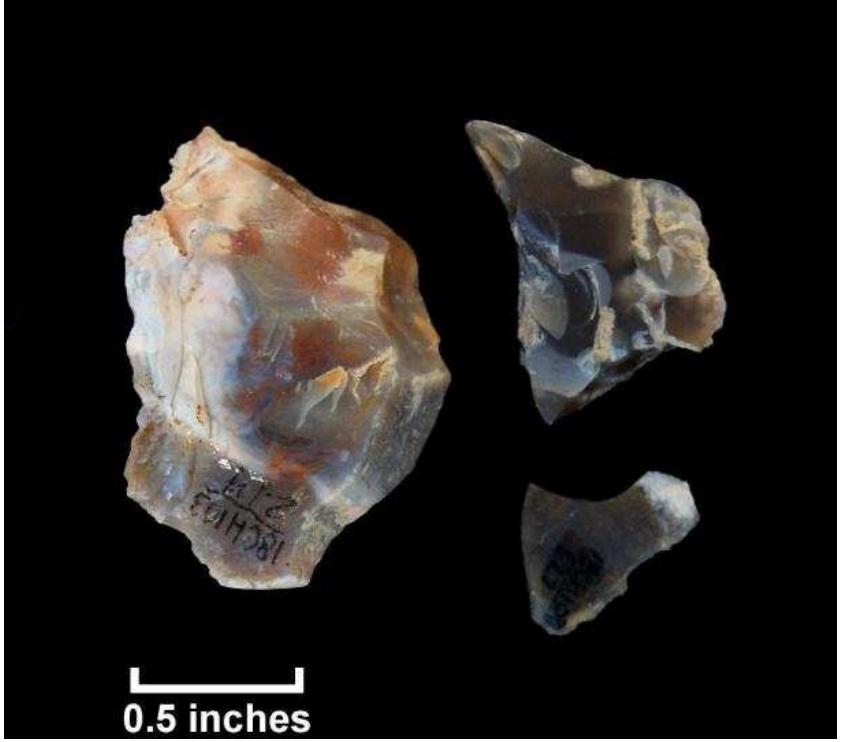 Figure 101. Flint fragments recovered from shovel tests, Hogue property; clockwise from left: T.nt 214. T.at 221. T.at 327 