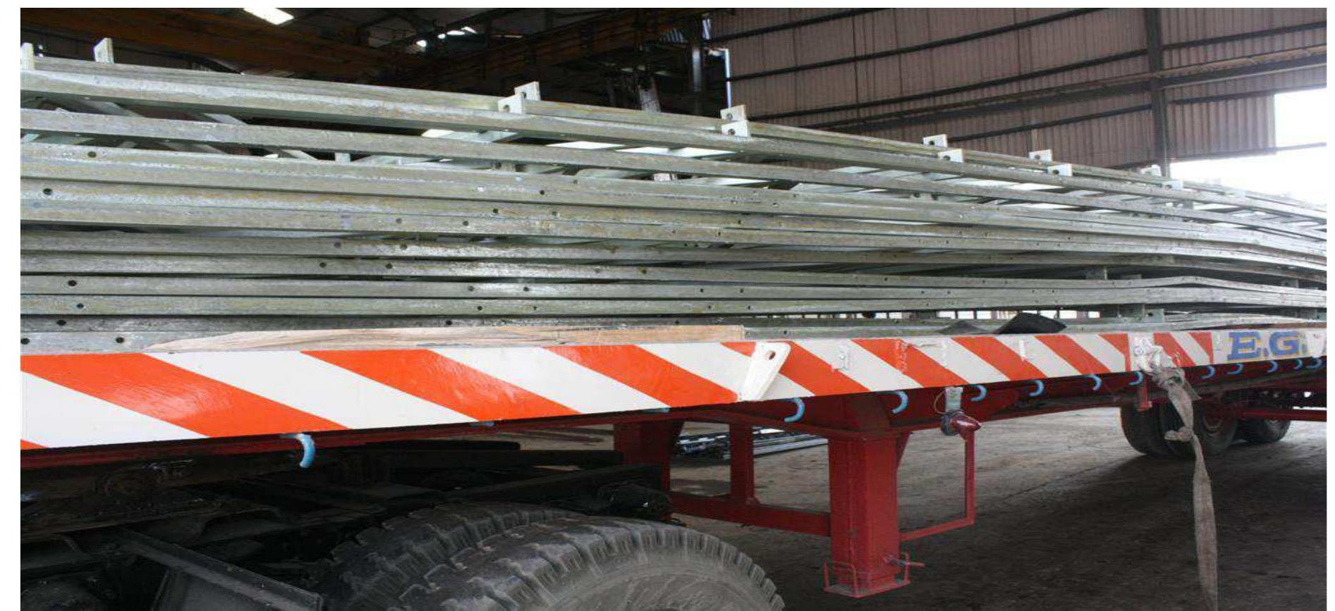 The frames of the torque box, which are an integral part of the solar collector assembly, were galvanized in Bajaj Electricals Limited, as Shrijee Heavy Works Private limited, did not have a 12 meter long galvanizing pit. Hence the frames in black had to be sent to Bajaj for galvanizing. Then, the frames had to be unloaded and finished, as the galvanizing quality was very poor and then repacked to be sent to the site. Handling the frames too many times did  result in cracks in some of the lower frames due to improper loading. The frames with cracks could not be used, so new frames were made without defects  Fig. 5 Improper loading of the frames on the trailer. 