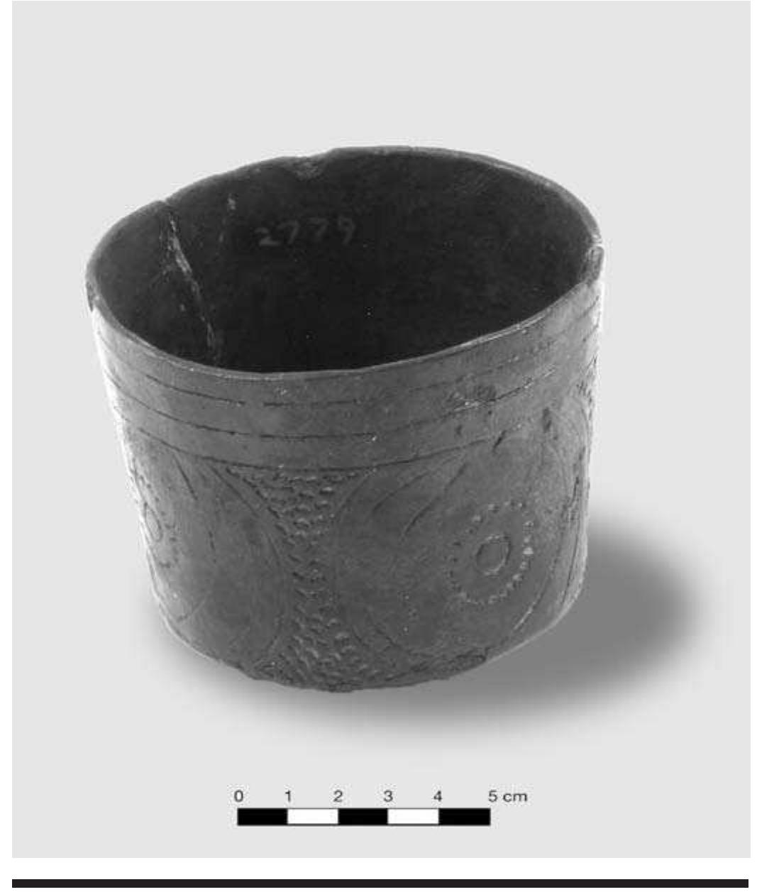 FIGURE 4.4. Crockett Curvilinear Incised bowl (423147).  design, and punctations done with a stick. The surface is burnished. This vessel is notable because it contains a thick deposit of what appears to be glauconite (a greenish mineral) in the base. The green residue underlies a buff-colored silt- like sediment. A base sherd from a separate cylindrical bowl (448642s02) exhibits a similar greenish mineral deposit. The presence of mineral deposits such as glauconite, which are clearly nonedible materials, indicates that these cylindrical bowls were probably for something other than food pro- cessing. A ritual or craft use seems likely. Perhaps these were used for preparing pigments used in painting. 
