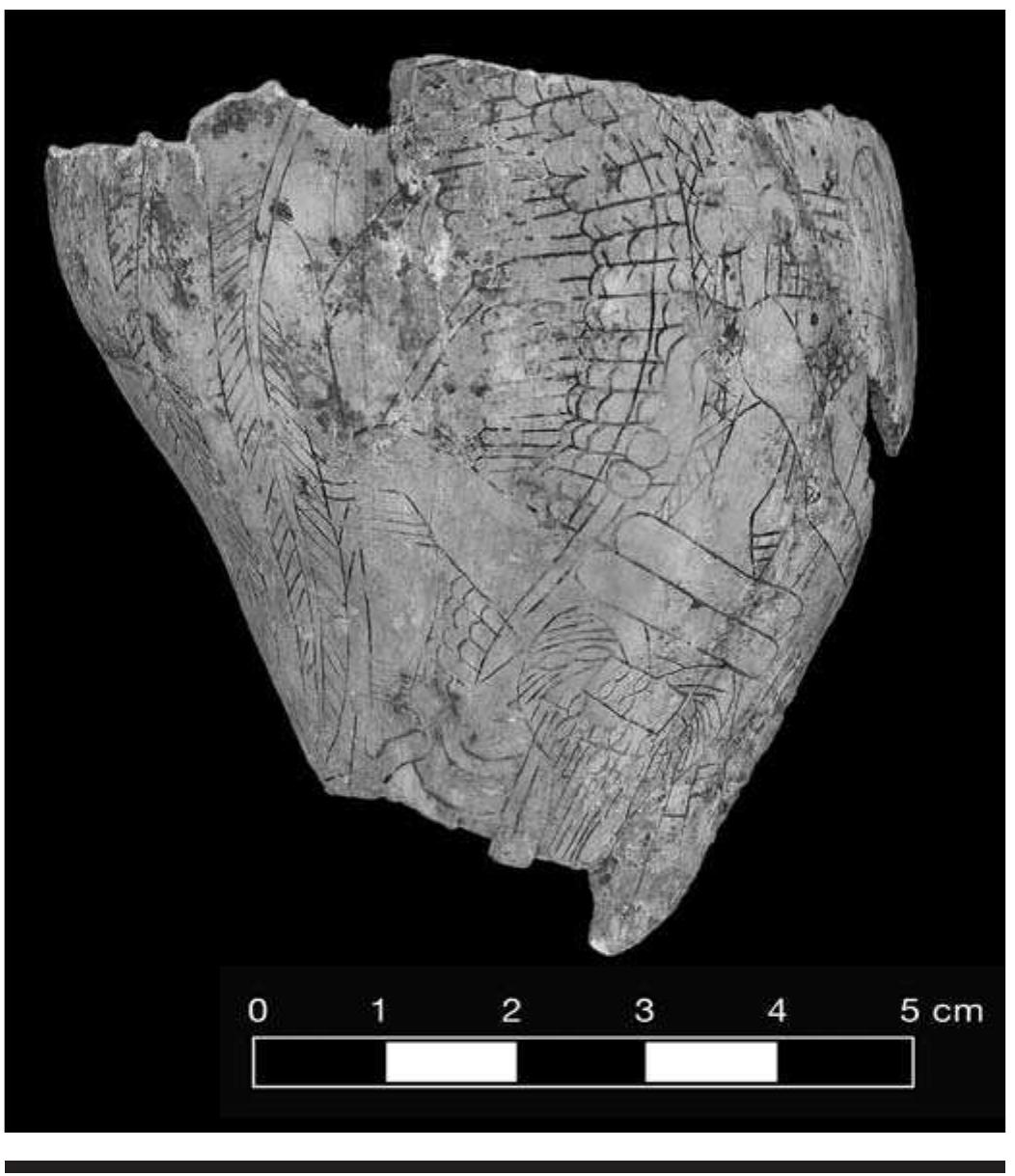 FIGURE 4.27. Craig A style carving showing birdman theme (448825). Note beaded apron, forelock, avian characteristics, and leg raised in movement. 