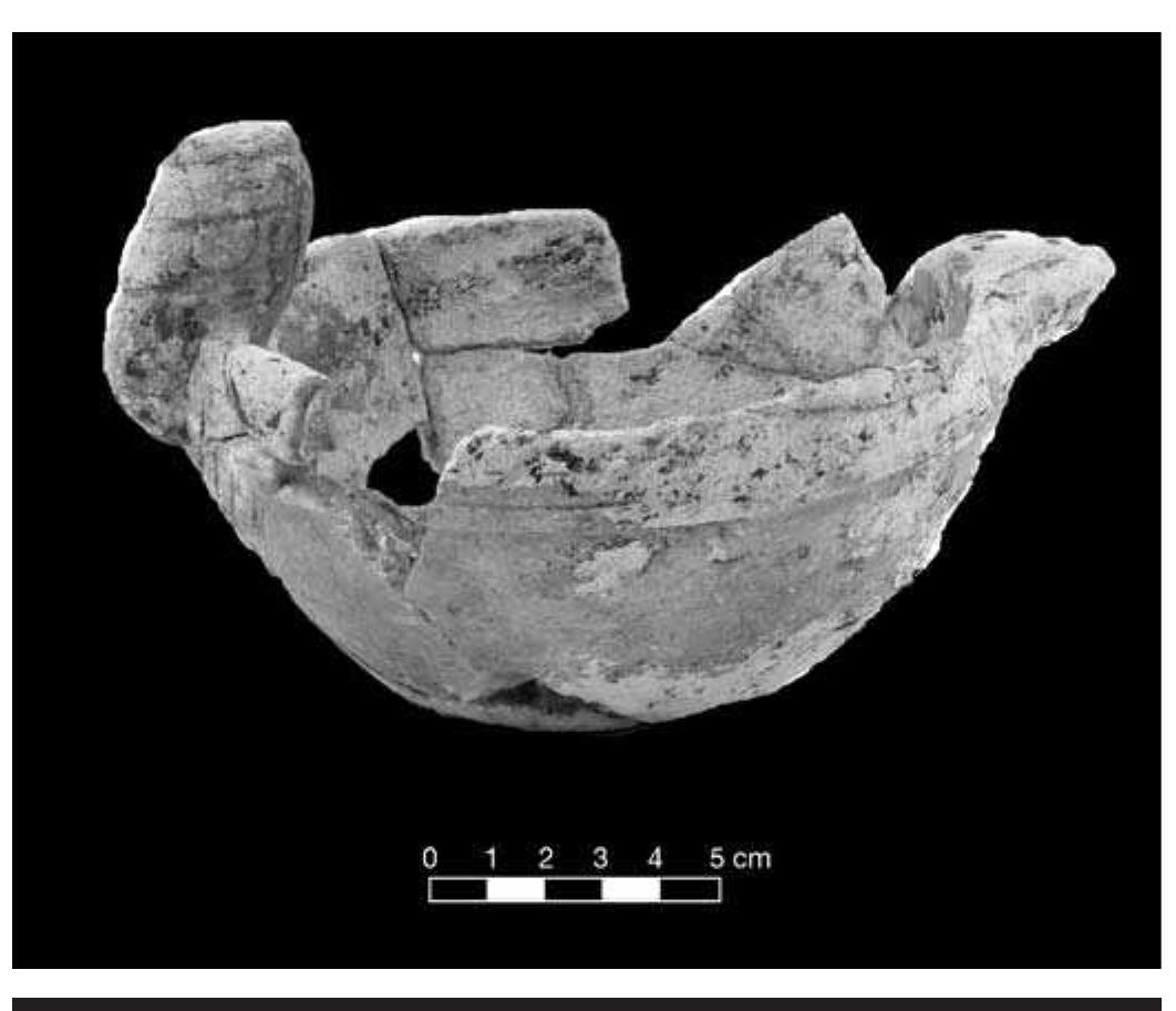 FIGURE 4.39. Limestone bowl with human effigy adornment (423149). 