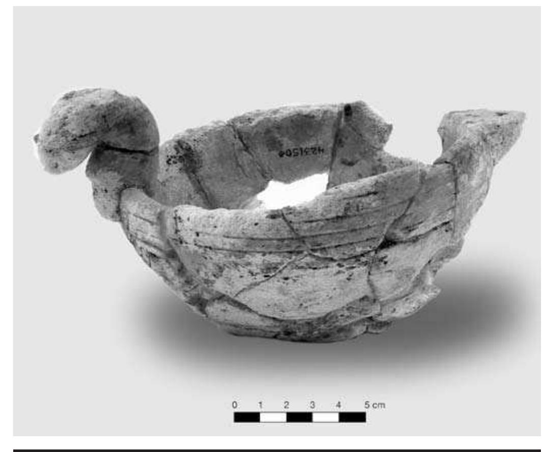 FIGURE 4.40. Limestone bowl with snake head adornment (423150). 