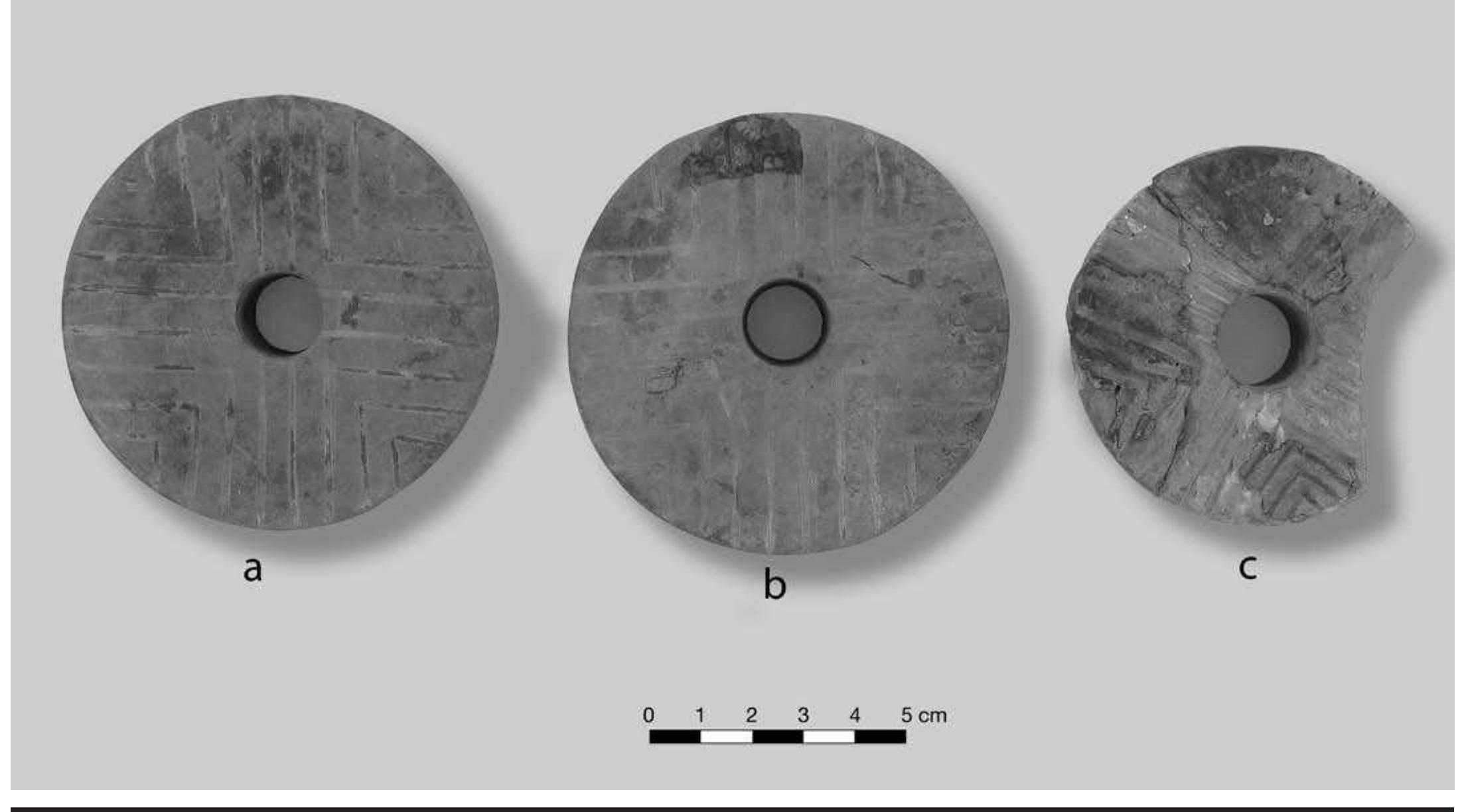 FIGURE 7.3. Earspools with chevron decoration: a, b, pair of earspools without copper foil (448691801, 448691s02); c, earspool with chevron design and copper foil (448692). 