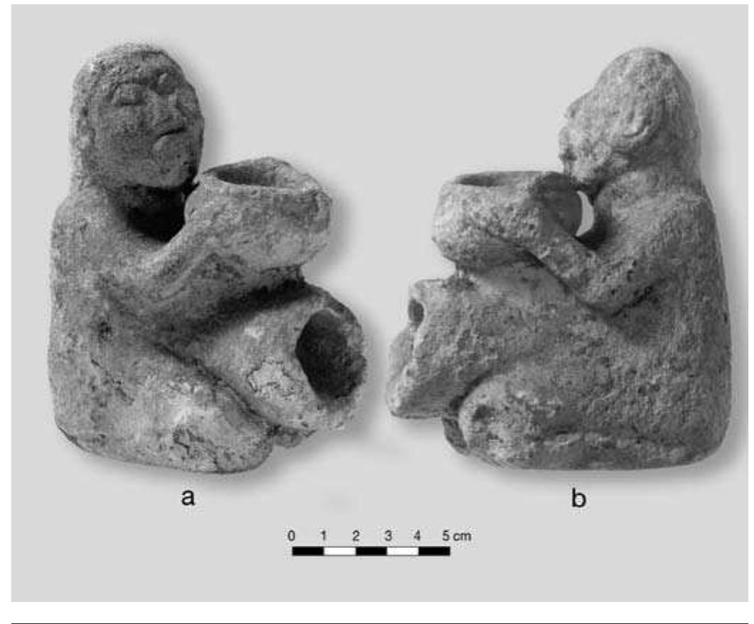 FIGURE 8.11. Human effigy pipe, pipe holder style (448663): a, oblique view front; b, side view. 