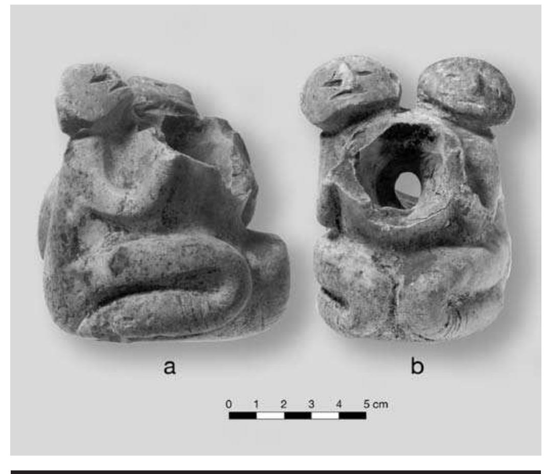 FIGURE 8.13. Two-headed human effigy pipe (448665): a, oblique view front; b, front view. 