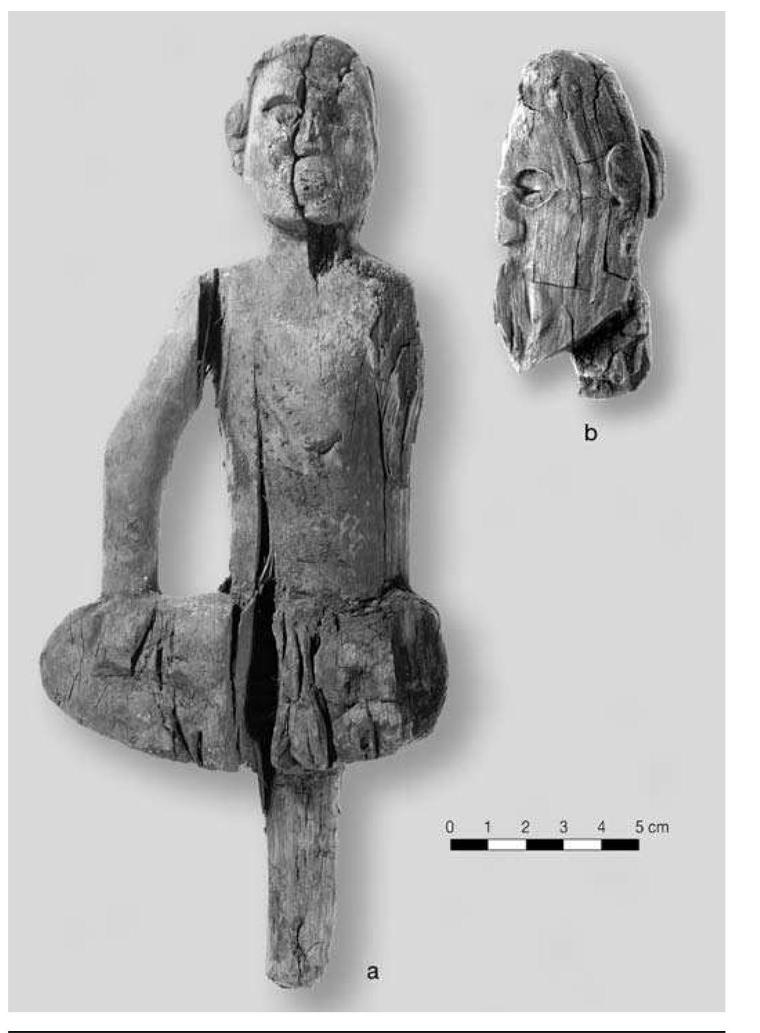 FIGURE 8.17. Wooden figurines: a, seated man with tenon (448891); b, head only (448896). 