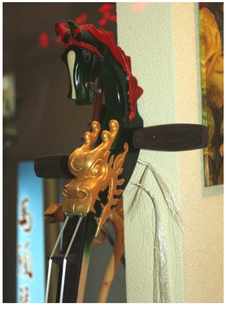 Figure 8: Longtouqin, “Dragon-Head Fiddle”?’  It is also important to note that the strings of the instrument and the hair on the bow of the 