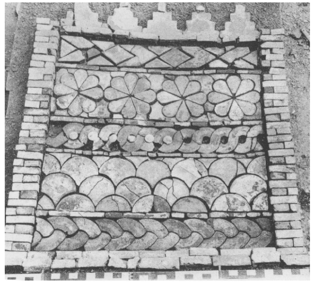 Fig. 10. Elements of glazed altar platform at Tell Halaf (Naumann 1950, Taf. 13.2).  pieces, but Naumann’s reconstruction, Fig. 10, incorporates crenellations at the top, above horizontal rows of chevron/rhombi, large rosettes, guilloche, scales, and knot- ted circles. The chevrons and scales are missing at Rabat, while the knotted circles are of a different type. 