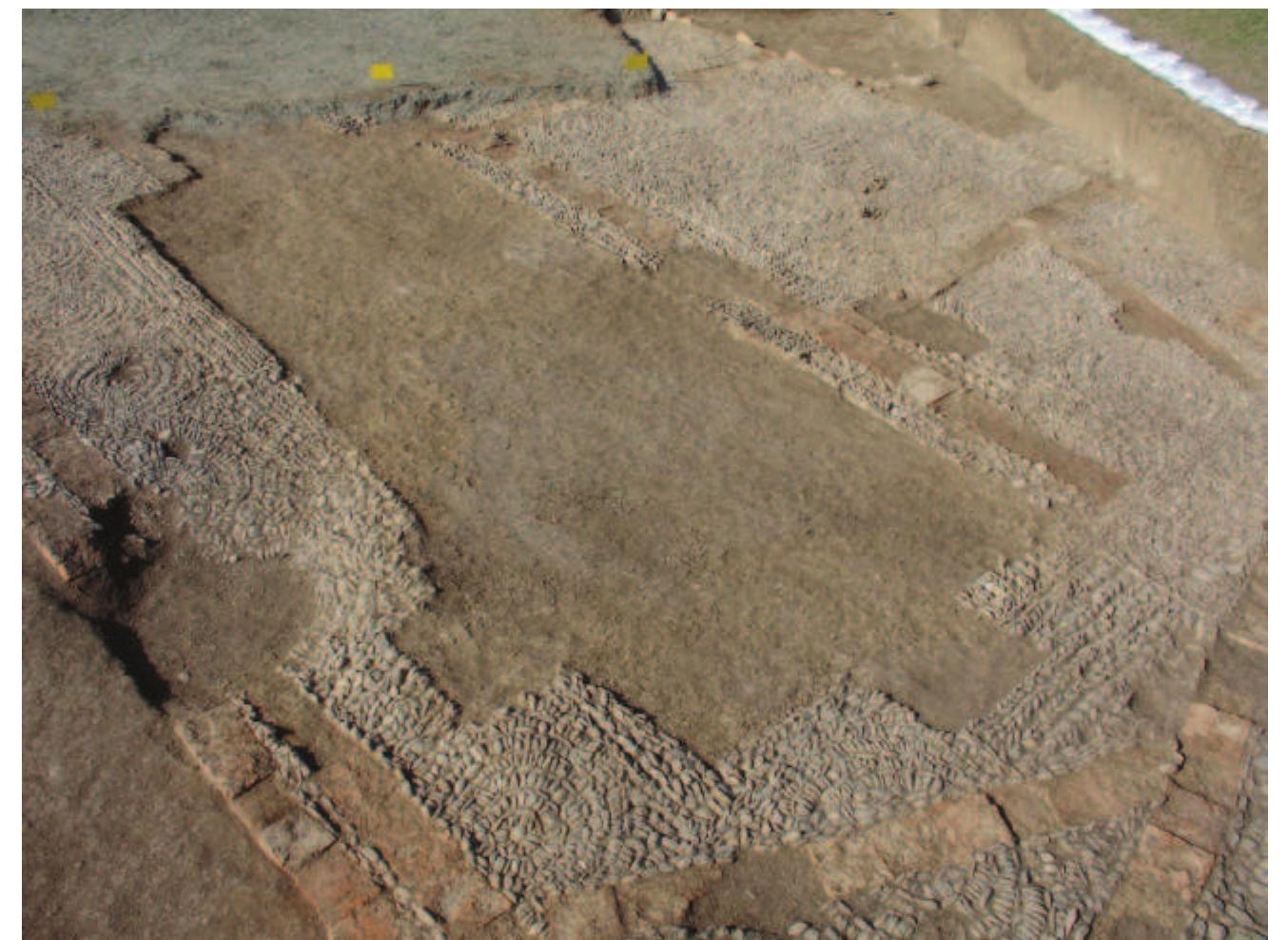 Fig. 5. View looking north-west across part of 2006 excavation, with soil covering part of the 2005 excavation at upper left. Courtesy of R. Heidari.  Plate II 