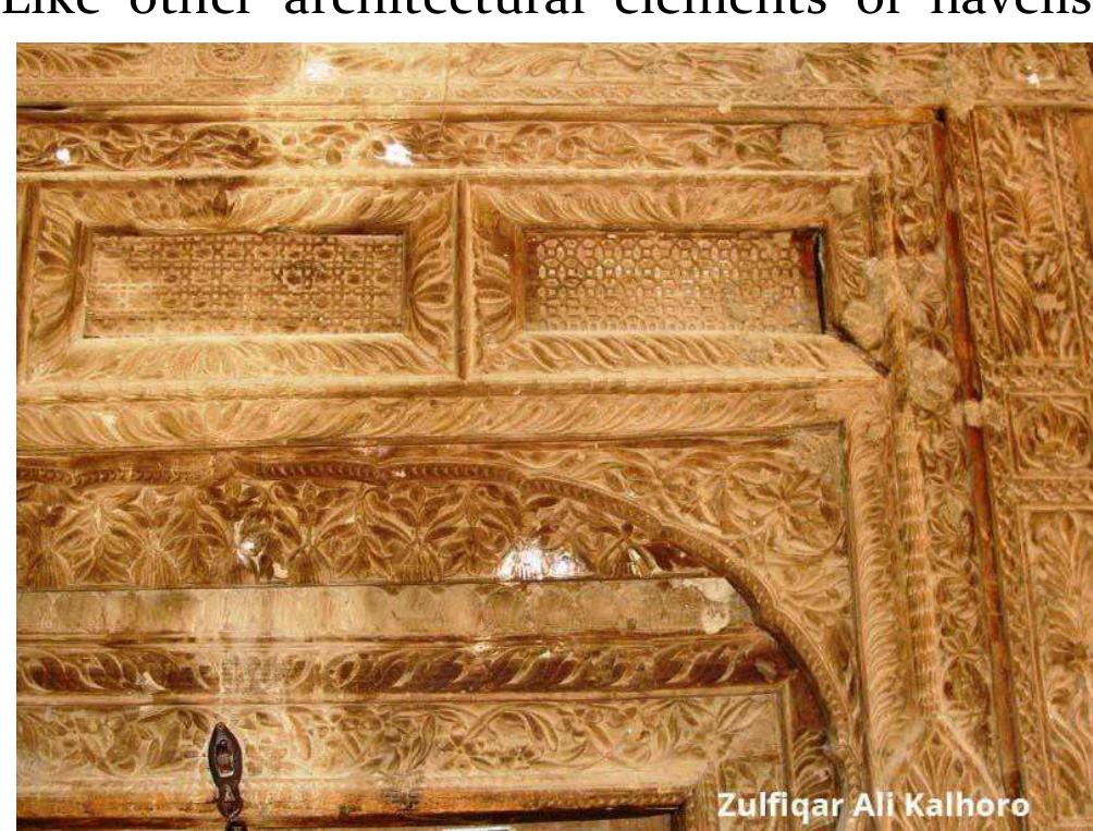 Wooden carved door of dr zaman haveli in basali