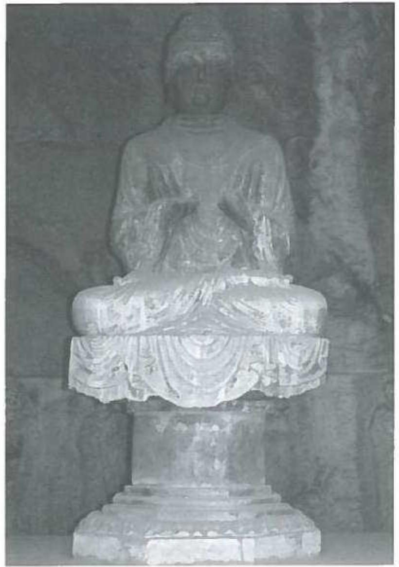 a) Seated Buddha, end of 7th- beginning of 8th century A.D Cave on the Dongshan. (Photo by the author). 