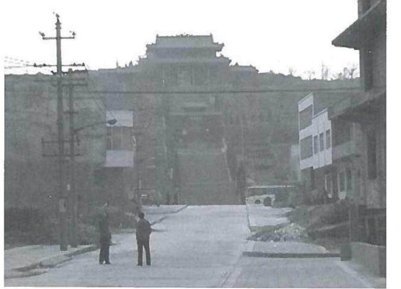 a) The western entrance of the actual Guanghua Temple from the town of Longmen. (Photo by the author). 