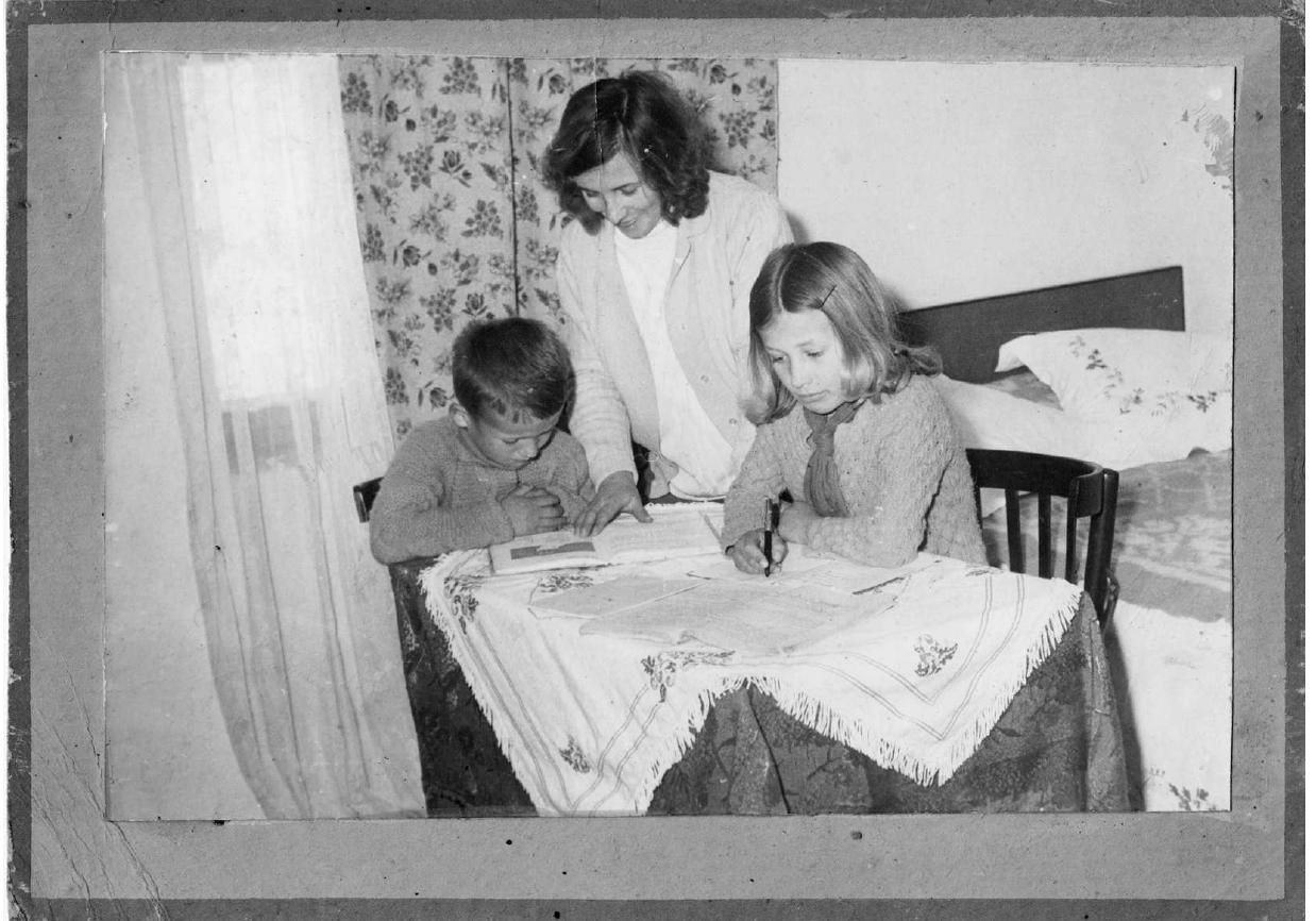 Fig. 3 Two children doing their homework with the help of their mother. This picture was taken by the father, an amateur photographer living in a village of Korg¢é, in 1976. It was enlarged, pasted on a cardboard with a painted frame and displayed in the village museum as an exemplary moment of family life. It stands in a mid position between propaganda photography and family snapshots. 