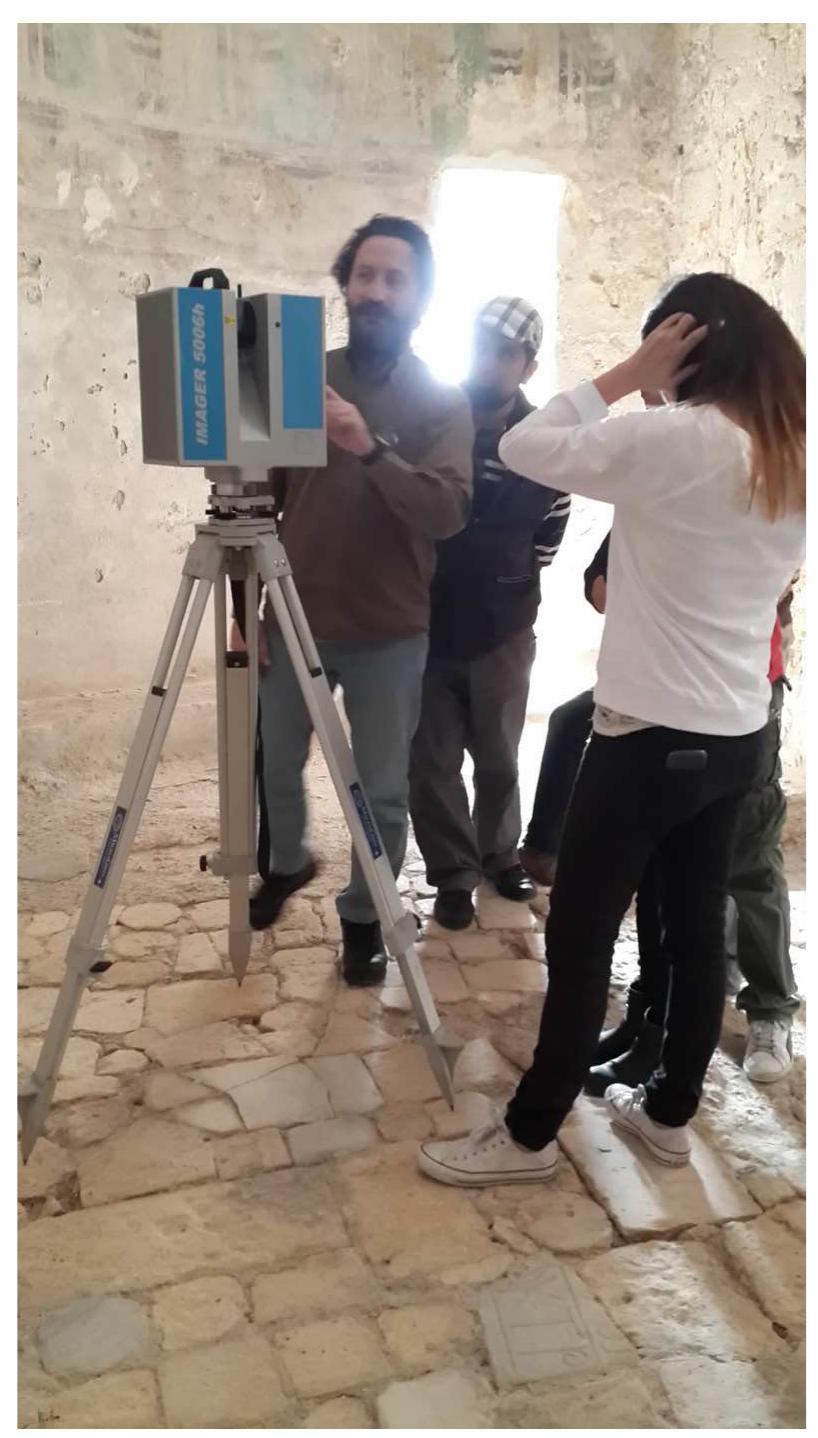 Figure 11 — Prof. G. Verdiani operating the laser scanne in the church. 2014 Workshop (photo: A. Camiz)  Figure 11 — Prof. G. Verdiani operating the laser scanner in the church. 2014 Workshop (photo: A. Camiz) 