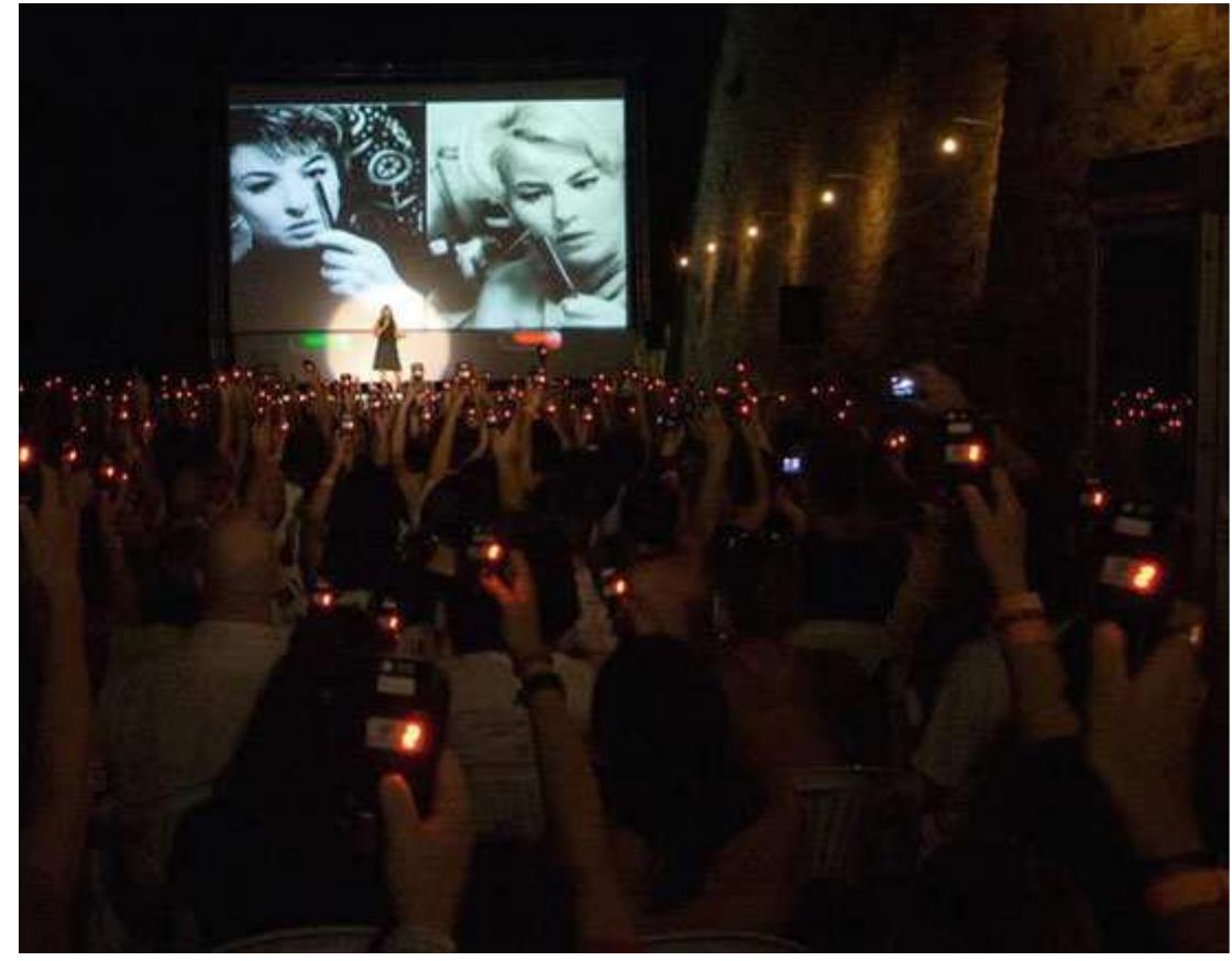Interactive cinema dates back to the 1967 experiment Kinoautomat (translation: automatic cinema machine) created by Radtiz Cingera for the Czechoslovakian pavilion at the Montreal Expo67 World’s Fair. The production One Man and His Home was shown in a specially designed presentation room where each seat was equipped with buttons. At several points during the presentation, the movie was stopped and the audience was asked to make a decision (Fig. 1) . Depending on the answer, the projectionist exchanged the lens cap between two synchronized film projectors. The underlying branching structure was carefully constructed to fold back after each choice, thus creating the appearance of interaction as Naimark observes: “The artfulness, [...] was not in the interaction but in the illusion of 