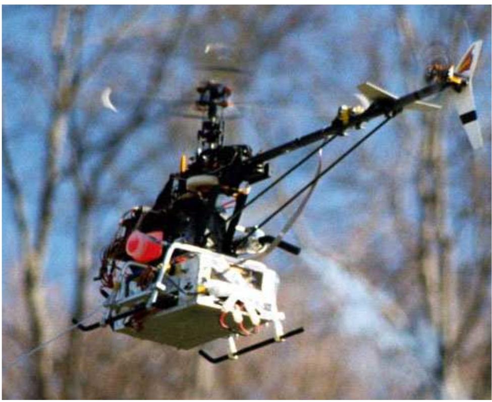 Figure 3 Instrumented X-Cell-90 helicopter in flight. 