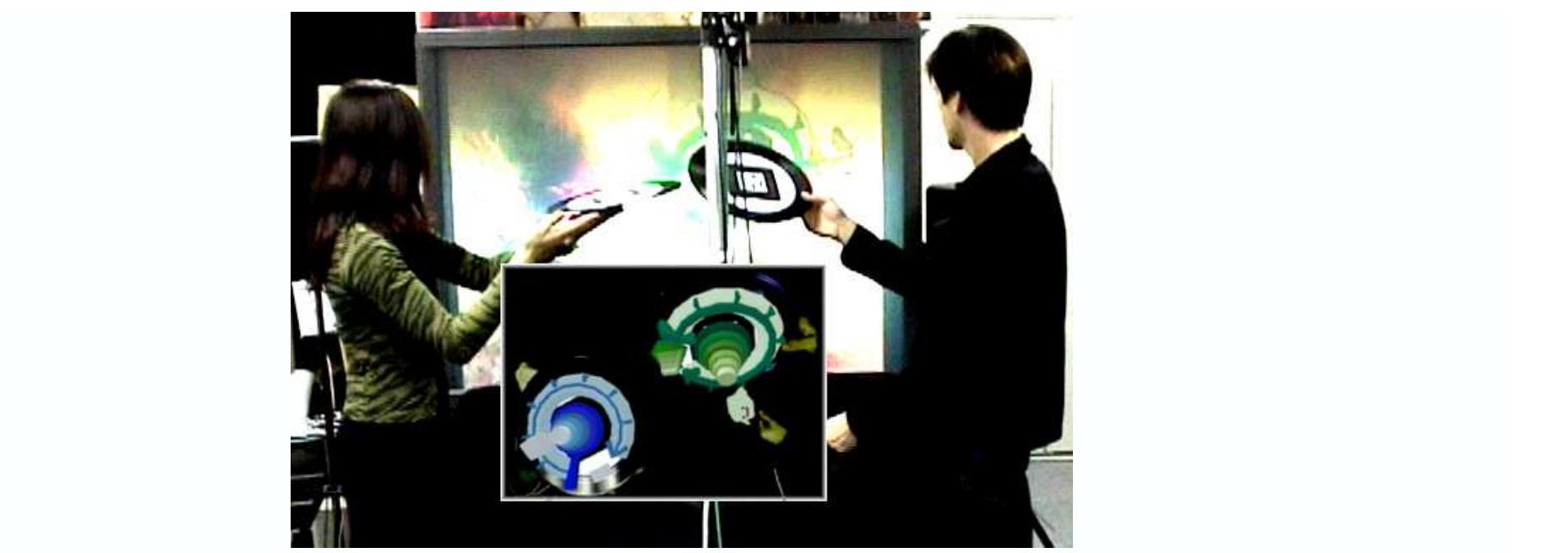 Figure 1: Two users are playing music in Augmented Groove: the insert shows the view on the projector screen
 With every technological leap musicians and engineers have been creating new ways to make and play music. This
quest has resulted in today’s electronic musical instruments, e.g. sound samplers and synthesizers, which opened
unprecedented opportunities for musical expression and creativity. Firstly, they allow musicians to synthesize virtu-
ally any sound even those that can not be produced naturally, expanding their musical vocabulary. Secondly, musi-
cians can create a composition without just having to use traditional instruments. Today’s electronic musical compo-
sitions are assembled out of hundreds of looped samples and MIDI sequences, modulated with filters, then se-
quenced and played back from a computer (Rule, 1999). Therefore, the proficiency in traditional musical instru-
ments is no longer a necessary prerequisite for creative musical expression.
 While the way music is made has changed significantly, the way it is played has not. Most of the synthesizers are
still equipped with piano keyboards and arrays of buttons and dials. These controllers are neither easy no enjoyable
to use especially for the novice. Currently, we are not aware of any effective musical controllers that would allow
the novice to control electronic music as performance, the only option being is simple playback after composition.
