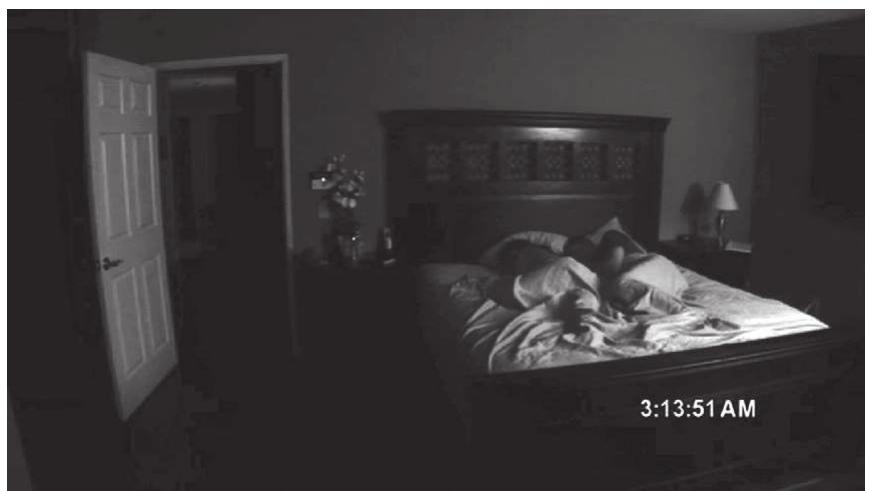 Figure 6. Static shots taken from the camera on a tripod are long in duration and invite us to look away from characters and scan the image for the manifestations of the supernatural. Paranormal  Activity (Paramount, 2007). 