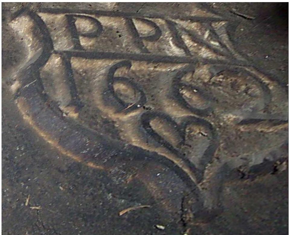 Fig. 12: Non-heraldic shield inside the chimney of the house of Pierre Parrenin dit Mossard, 1662 (photo by Bruno Monnet). 