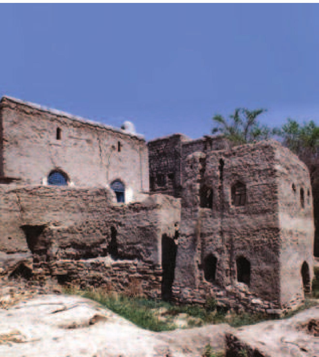 BC with the Persian introduction of the sophisticated aflaj irrigation system, although oth wadi surface flow and wells continued to complement the falaj. The spring (‘ayn) vad always irrigated the zara‘ (garden), <nown as Harat al-“Ayn — the land within the southeast corner of the walled settlement dominated by the spring (16). Even after the settlement was deserted and until it finally ran dry not so long ago, the spring aided  oy the water from a zajrah (jazrah) well  (cf. Chapter 6, 17), continued to support small crop farming within the zara*. As the 2xistence of disused wells show, the zara‘ was once much more extensive than its resent area would suggest and probably =xtended as far north as Masjid ash-Sharah, and west up to the western settlement wall.  with the circle of ideas associated with the notion of sacredness discussed above. It is plausible that this triadic relation between the spring (al--Ayn) , the sanctuary (Masjid al--Ayn) and Harat al-‘Ayn will have existed from the early days of settlement — a possibility further enhanced by its reputation as the oldest masjid of the settlement (Baldissera 1994: 69 & 63), and will have played a crucial role in defining subsequent settlement development and its structure. That the mosque takes its name from the spring itself seems to place the latter at  the focal point of the sacred enclosure and seems to echo Robertson Smith’s assertion, 