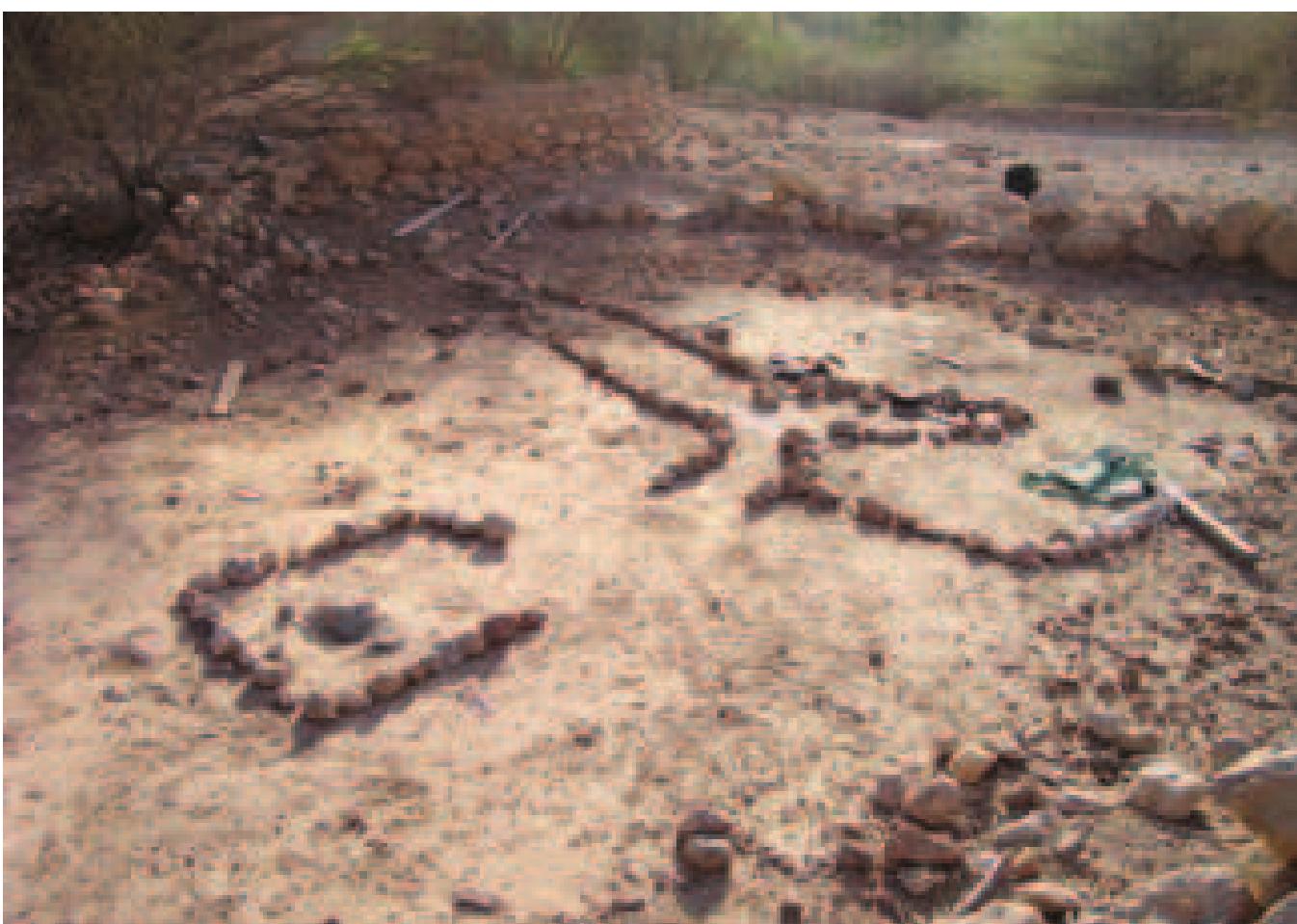 Figure 20: Ritual site in Qalhat, Bowshar.  ‘Uthman. An Omani literary image going back to the fifth/ eleventh century likens the true learning (al-silm) to a bird: “the egg was laid in Madina, it hatched in Basra and it flew to Oman via a teacher line of impeccable descent (hamalat al-silm), the tru: madhhab was developed ...” (Wilkinson 1987: 152). Folklore from Wadi Bani Khalid perhaps alludes to this ‘pure’ channel of knowledge that linked the centre of Islam and Oman; in Wadi Bani Khalid, it is said, a spring called ‘Ayn Saruj has the water flowing in it coming from Iraq. This, the tradition adds, was proved when a caliph in Baghdad dropped his camel-stick into the Euphrates and it reappeared in the Wadi Bani Khalid (Carter 1982: 172). This is significant, since the conscious effort to link up with certain early Islamic traditions was an integral part of the revival and indicative of the search for the true faith. The names of two imams of late-fifteenth and early- sixteenth centuries — ‘Umar al-Khattab and ‘Umar ash-Sharif — suggest that they were “not real names, but adopted, symbolic throw-backs to the purity of the original Muslim state” (Wilkinson 1987: 350 n. 26). Each time a tyrannical ruler (iababira)  and early-sixteentn centuries, Ibadism began to stage a struggled resurgence, fighting against the almost half a millennium of  what the Ibadis dubbed as the ‘the dark ages’ of Nabahina rule, in which Nizwa, Bahla and Manah played an important role. Not surprisingly, the reconstruction of mosques and the embellishment of some  of the key ones with beautifully decorated maharib (s. mihrab), served as important symbols of this revival (cf. Chapter 10). The wealth confiscated by the Imama from the Nabahina ruler Sulayman b. Sulayman and  his followers financed the mihrab decoration project. Manah became a sanctuary of a school of artisans who, under the guidance of ‘Abdallah b. Qasim b. Muhammad al- Humaymi, created numerous exquisitely decorated maharib, unsurpassed in beauty and character. All three mosques on Ka’b al- Bilad, including Masjid al--Ayn, benefited from the initial phase of this massive effort, while Masjid al-Jamis also got its decorated mihrab slightly later. As | argue in my discussion on the mihrab, underlying the decorative schemz are representations of flowing water and the conflation of the physical topography of the aflaj with the celestial stellar topography. 