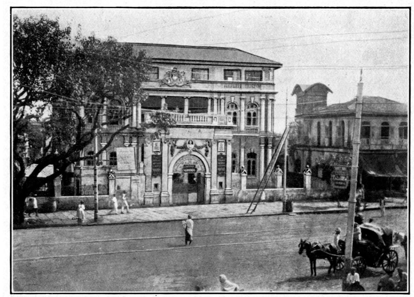 In this theatre on the first floor there are private boxes with four seats each. The amount of the season tickets for these is Rs. 3400, but Mr. Nazir has promised that this money would be kept in a bank to pay the actors coming from abroad. This tells us that the large sum of Rs. 20,000 will be spent to pay the actors for just one season. The cost of the reconstruction of the theatre would come to Rs. 40,000. At the top a small dome will be built above the theatre. In the lower portion will be the stalls and the third class. In total there would be a  Source: Charles Jasper Sisson, Shakespeare in India: Popular Adaptations on the Bombay Stage. 
