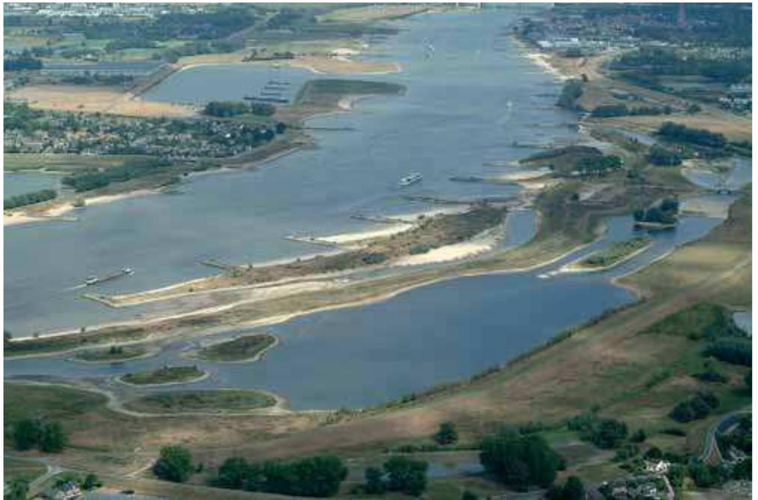 agricultural land (Smits et al. 2006). But periodic storm- floods destroyed the seawalls and recaptured parts of the reclaimed land. Between 1900 and 1950, an area of ~10 000 km? had a large number of islands and peninsulas, deep and shallow tidal channels, extensive intertidal sand- and mudflats reaching up to 20 km from the coast, vegetated coastal plains, and salt and brackish marshes above mean high water. The most landward parts of the estuaries, where the Rivers Rhine, Meuse and Scheldt enter the delta, were characterized by freshwater tidal marshes and willow coppice.  flooding. The core of this project was to maintain a safe coastline, and called for the closure of main tidal estuaries and inlets in the SW Netherlands, except for Westerschelde and Nieuwe Waterweg. The former (semi-)estuaries Veersche Gat and Grevelingen were isolated from the North Sea by high sea-walls in 1961 and 1971, respectively, and converted into non-tidal lakes or lagoons filled with brackish or saline water. The Haringvliet was closed in 1970 by the construction of large sluices, meant to function as an outlet for the Rhine and Meuse. Construction of primary sea-walls in the mouths of estuaries included the need to reduce tidal- current velocities in the estuaries by constructing secondary compartmental barriers (Zankreekdam, Grevelingendam  and Volkerakdam).  