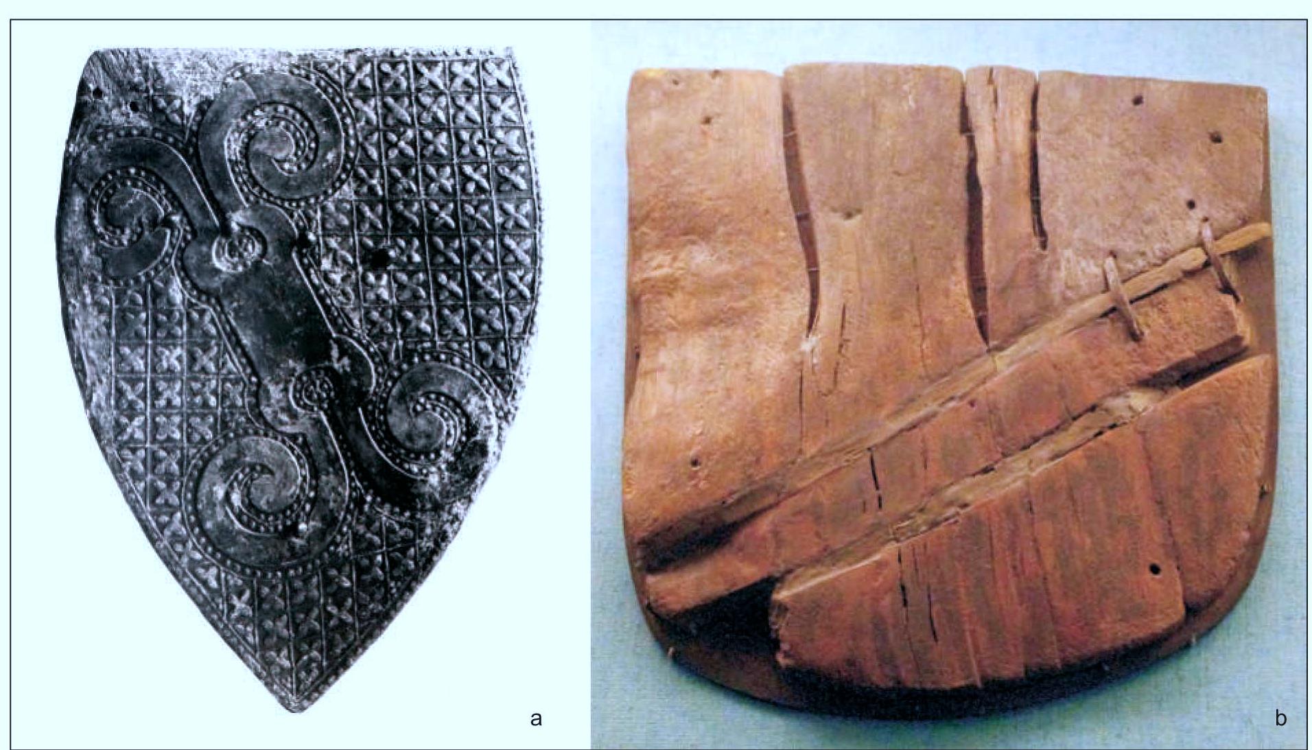 Fig. 8. Extant, 14" c. knightly shields: a— belonging to the Herren von Welfenberg, Manesse form, Museum fiir Kunst- und Kulturgeschichte der Philipps-Universitat Marburg (after Kohlmorgen 2002); b — one of the two specimens excavated at Boringholm, National Museum Kopenhagen (photo by L. Marek). 