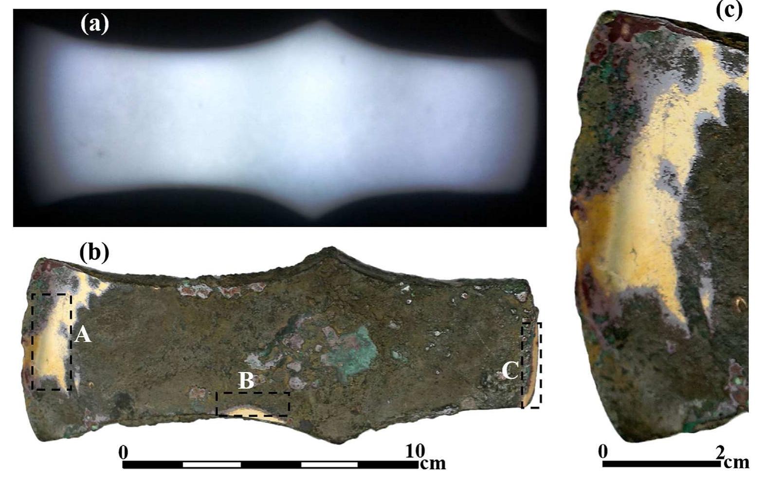 Fig. 4. The bronze axe from Tel Beth-Shemesh (P-CS): (a) radiographic image of the axe reveals that its bulk metal is well preserved; (b) areas A, B and C of the axe after the partial remov of the oxide layers; and (c) the edge of the axe, area A, after its oxide layer was locally removed.  Since the three objects were cleaned after they were grinded and polished, it is assumed that Si residues from the grinding process can  The weight of the hoe is 694.5 g; and its dimensions are: length of 15.2 cm, width of 6.8 cm and thickness of the cylindrical part of the socket between 0.2 and 0.4cm (Table 1). The socket's thin walls indicate that this part was heavily worked into its final shape. 