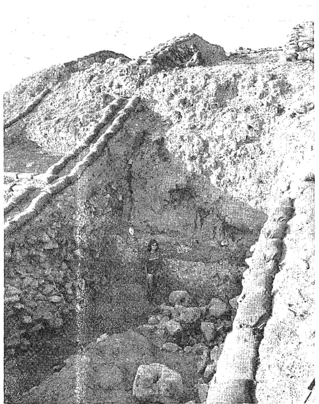 nly by digging the core of the outer revetment tower and the main wall.  The stone-built glacis forming the fagade of the main city wall was completely incovered in Squares L-M/6 (Figs. 10, 12-13). The upper end of the glacis was .50—2.00 m. beneath the top of the main city wall, while its bottom reached the yack of the ‘balcony’ at the top of the outer revetment tower. Layers of small ebbles were found in the lower part of the brick debris accumulated at the foot of he stone-built glacis (Figs. 12-13). They seem to have eroded or fallen from the top f the wall which apparently had been paved with pebbles. It is not clear whether a rotected position for warriors to stand and fight was prepared at the top of the nain city wall.  The stone-built glacis forming the fagade of the main city wall was completely 