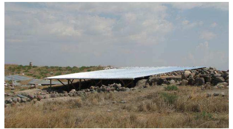 Figure 13: Operation B, view from north of the shelter at the end of the construction phase, when the roofing done with corrugated metal sheet was completed. 