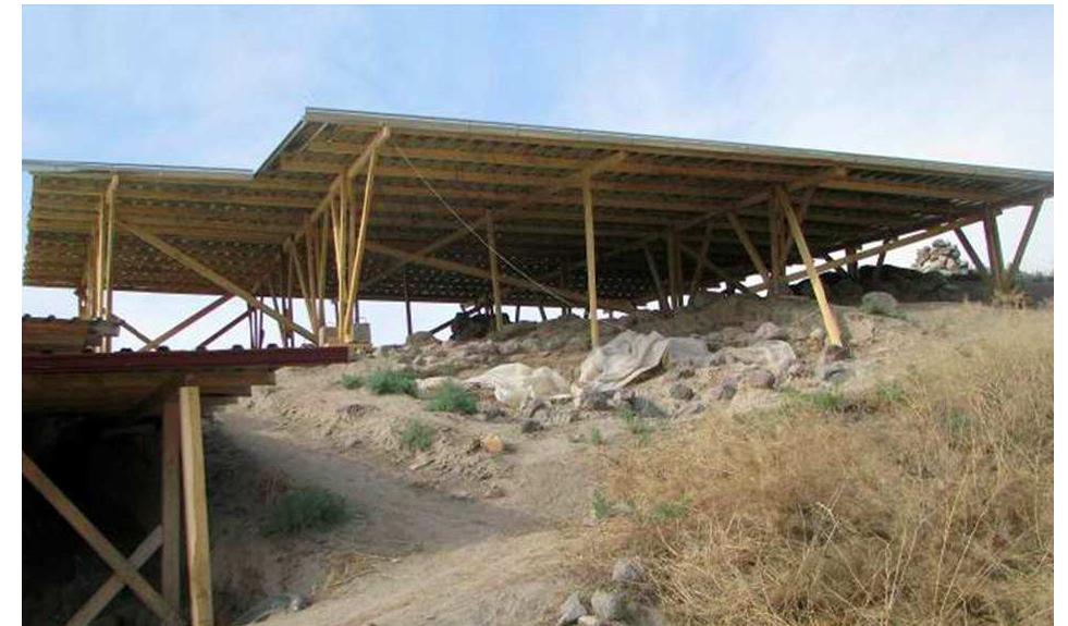 Figure 14: Operation A, view from north of the shelter at the end of the construction phase.  sides of the excavation area — this shelter was a little higher from ground level than that built the previous year in the same Operation A. 