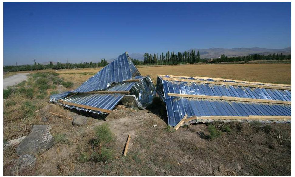 Figure 25: In a close-up view of the metal sheets torn away from Operation B, we can see that they are rolled up on themselves. 