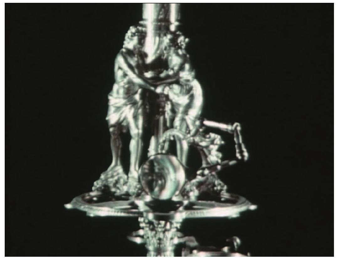 Figure 9. Silver-plated antique microscope 