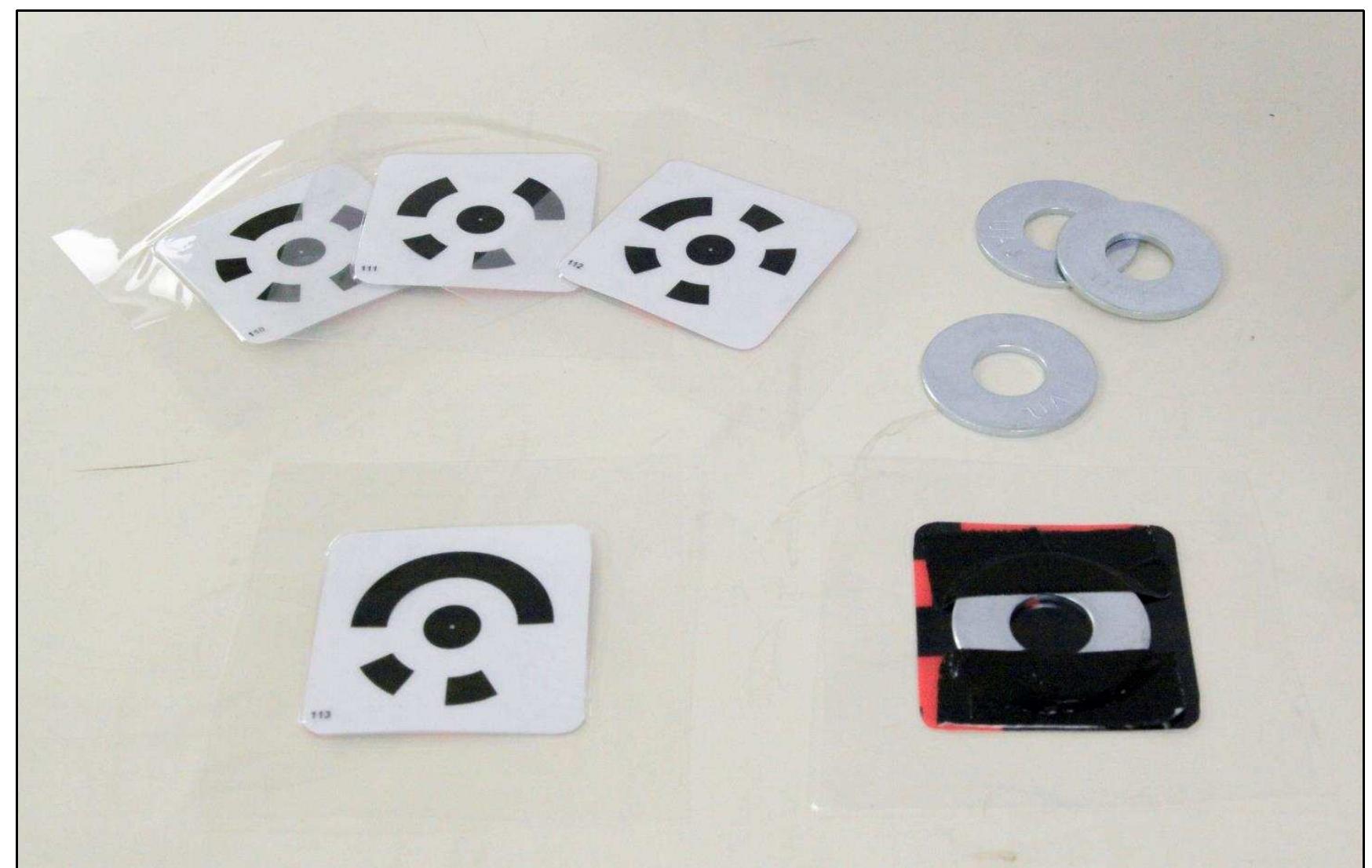 Figure 2-6. Underwater coded targets and their additional weights (zinc washers). (Photo: Y amafune)  The targets were printed on Mylar (plastic paper) to take advantage of the  target durability (Fig. 2-6). 