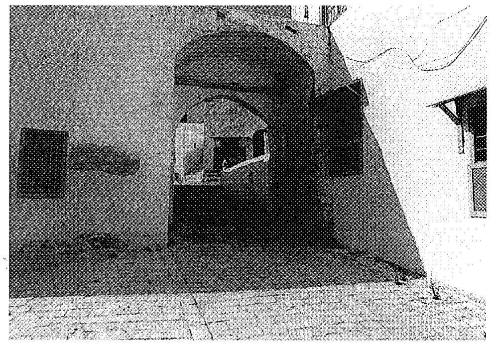 Fig. 9. Sidi Bou-Said. The most common trace of a gate is the upper part of a wooden frame with holes on both sides.  The dead-end street was used as a kind of living room for the residents around it. As shown in fig. 11, an indi- vidual had to pass through the gate of a town to enter place 1, then to pass through a second gate to enter place 2, and so on. Horizontal lines indicate boundaries be- tween places that would have had gates: 1 designates the most public, 2 a shared place for quarter residents, 3 a dead-end street, and 4a dwelling, but 2 and 3 can also be 