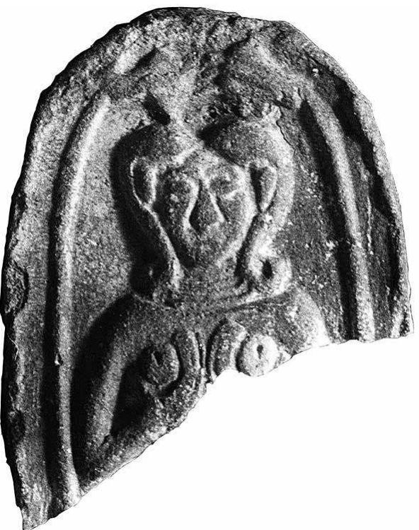 FIG. 12. “Qudshu’ terracotta plaque figurine fragment from level IVA (phase RG 3b) brickwork (field photograph 6208, Kaplan Archive; courtesy Israel Antiquities Authority). 