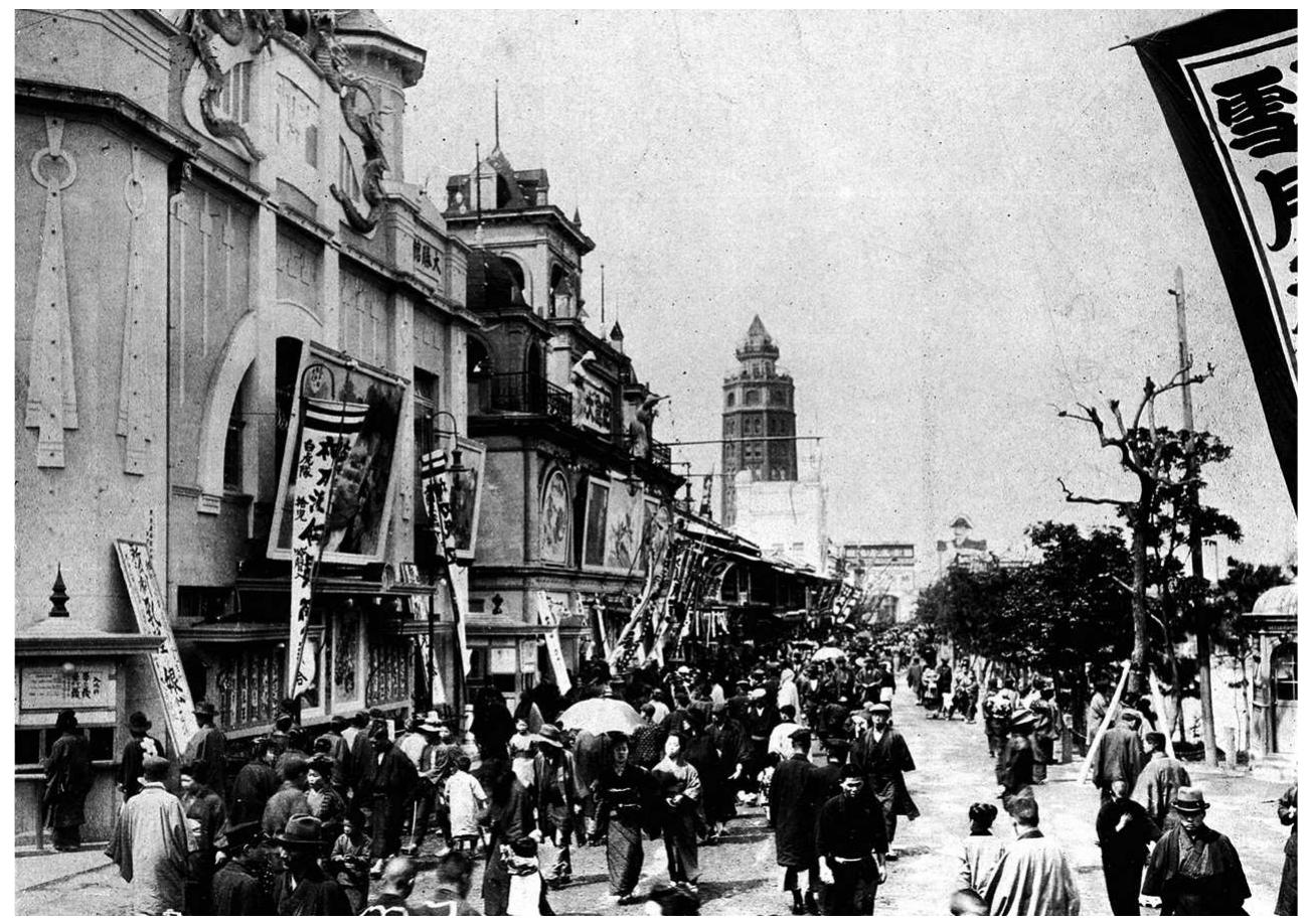 Figure 3. Asakusa’s moving picture district in 1910, showing the garish banners and ornate facades of the Taishokan and the Sekaikan. (Courtesy of the National Diet Library, www.ndl.go.jp) 