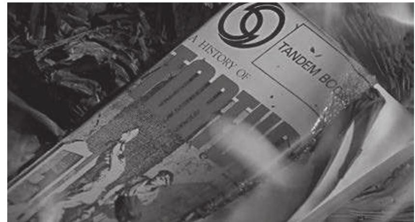 Figure 3. The firemen burn a text about the history of torture ir Fahrenheit 451 (Anglo Enterprises, 1966). 