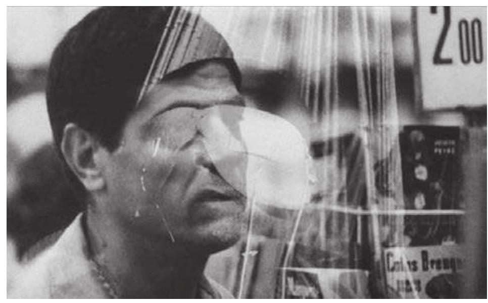 frontier between the two.°? As with his reading of Cocteau’s Orphée, Marker invests the immaterial reality of dreams and “internal adventures” with the visceral qualities of flesh and blood. By overlaying the space of the camps over the space of the museum, or faint images of the man’s writhing body over the hypnotic scene of the department store (Figure 7), he presents “culture” as the site where France went to purify itself from the crimes of the dirty war. 